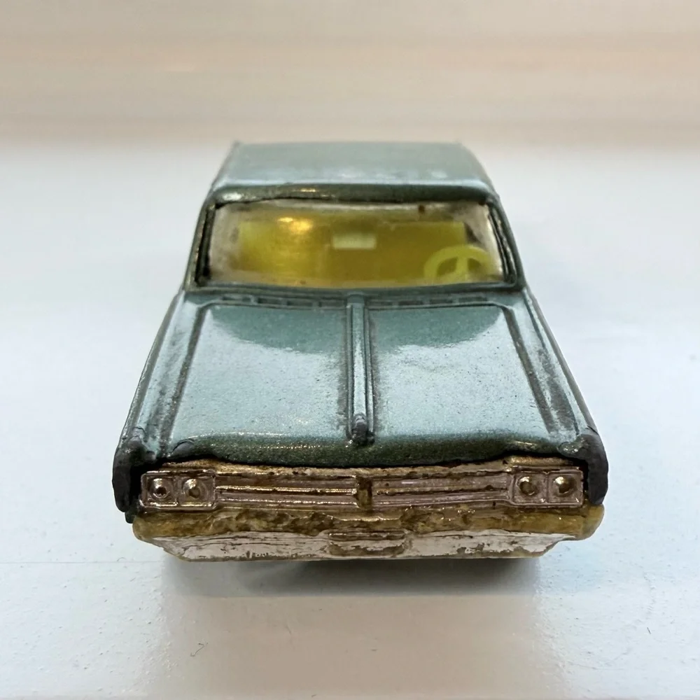 Vintage Husky Oldsmobile Starfire Coupe die-cast toy car rare green